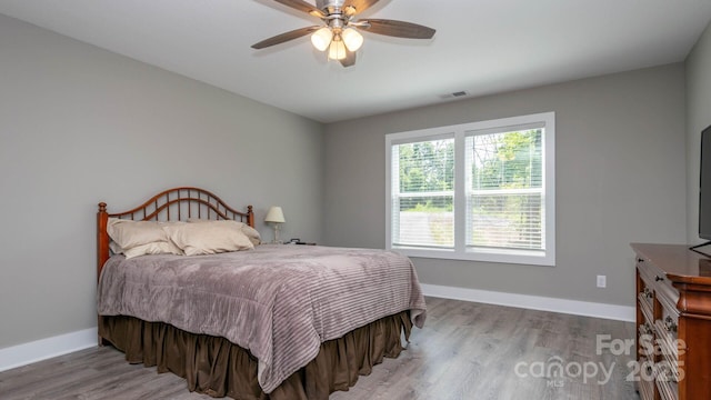 28 Arnie Dr, Etowah, NC 28729 - bedroom featuring a ceiling fan, wood finished floors, and baseboards