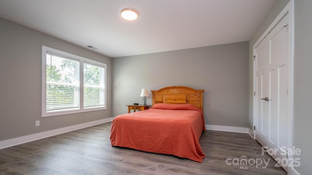 28 Arnie Dr, Etowah, NC 28729 - bedroom featuring visible vents, baseboards, and wood finished floors
