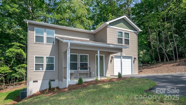 28 Arnie Dr, Etowah, NC 28729 - view of front of house with aphalt driveway, covered porch, an attached garage, crawl space, and central AC unit