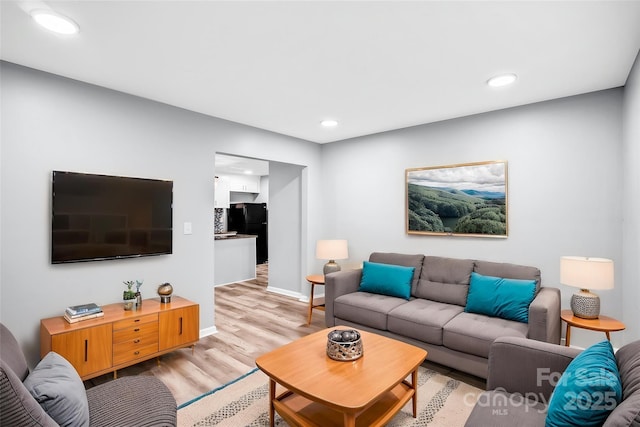6628 Cool Water Ct, Charlotte, NC 28215 - living area with light wood-style floors, recessed lighting, and baseboards