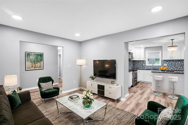 6628 Cool Water Ct, Charlotte, NC 28215 - living room featuring light wood finished floors, recessed lighting, and baseboards