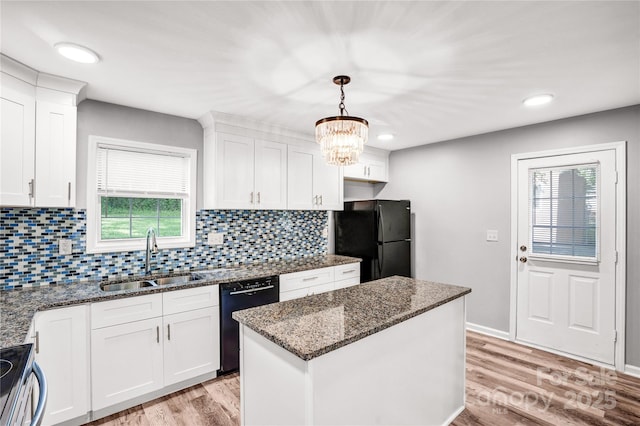 6628 Cool Water Ct, Charlotte, NC 28215 - kitchen featuring a sink, black appliances, white cabinetry, light wood finished floors, and recessed lighting