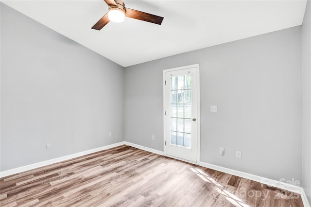 6628 Cool Water Ct, Charlotte, NC 28215 - empty room with wood finished floors, ceiling fan, and baseboards