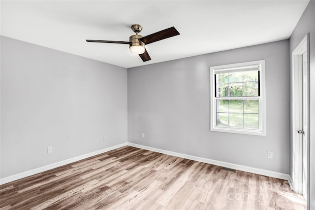 6628 Cool Water Ct, Charlotte, NC 28215 - empty room featuring wood finished floors, a ceiling fan, and baseboards