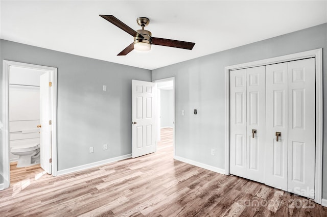 6628 Cool Water Ct, Charlotte, NC 28215 - unfurnished bedroom featuring wood finished floors, baseboards, a closet, ensuite bathroom, and a ceiling fan