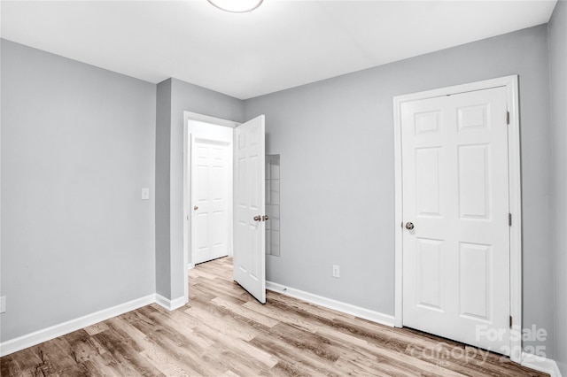 6628 Cool Water Ct, Charlotte, NC 28215 - unfurnished bedroom featuring wood finished floors and baseboards