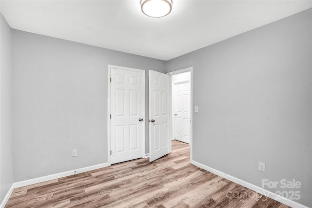 6628 Cool Water Ct, Charlotte, NC 28215 - unfurnished bedroom with wood finished floors and baseboards