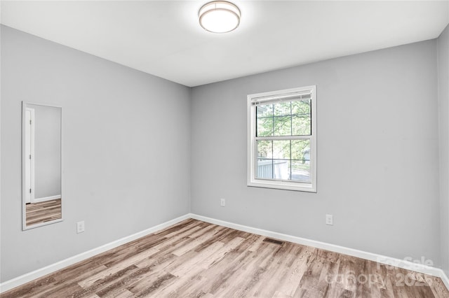 6628 Cool Water Ct, Charlotte, NC 28215 - spare room with wood finished floors and baseboards