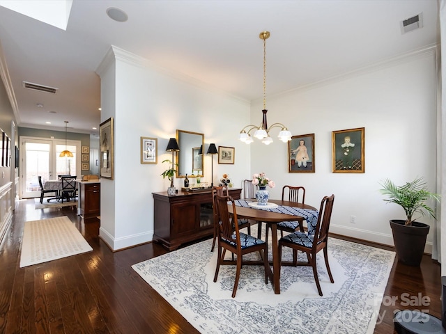 6301 Park Dr S, Charlotte, NC 28210 - dining space with a chandelier, baseboards, crown molding, and dark wood-style floors