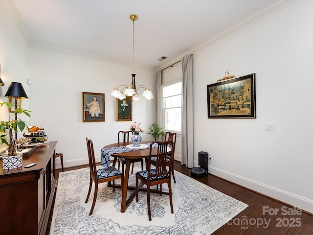 6301 Park Dr S, Charlotte, NC 28210 - dining area featuring a chandelier, crown molding, dark wood-style floors, and baseboards