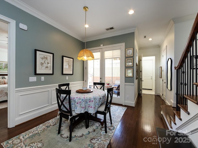 6301 Park Dr S, Charlotte, NC 28210 - dining space with stairway, dark wood-type flooring, crown molding, a wainscoted wall, and french doors