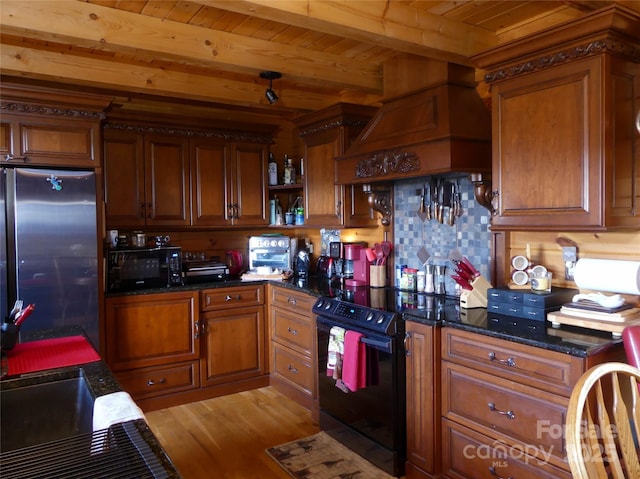 133 Saratoga Dr, Bostic, NC 28018 - kitchen featuring light wood-type flooring, beam ceiling, brown cabinets, wooden ceiling, and black appliances