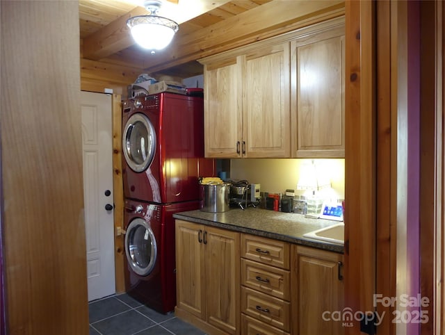 133 Saratoga Dr, Bostic, NC 28018 - laundry area featuring a sink, dark tile patterned flooring, wood ceiling, and stacked washer / dryer