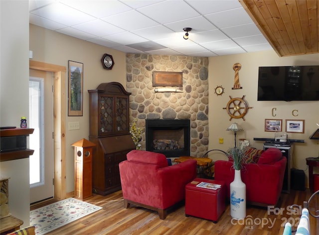 133 Saratoga Dr, Bostic, NC 28018 - living area featuring a drop ceiling, a fireplace, and wood finished floors