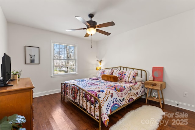 bedroom with baseboards, wood finished floors, and a ceiling fan