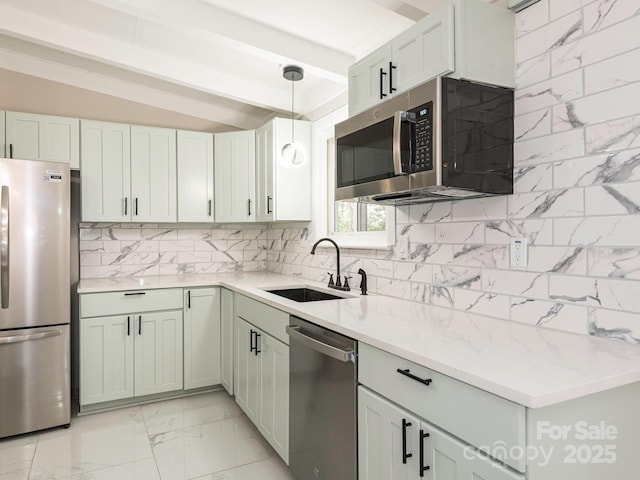 kitchen with lofted ceiling with beams, marble finish floor, tasteful backsplash, appliances with stainless steel finishes, and a sink