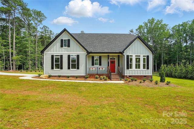 409 Henry Chapel Rd, Belmont, NC 28012 - modern farmhouse featuring board and batten siding, a porch, crawl space, and a front lawn