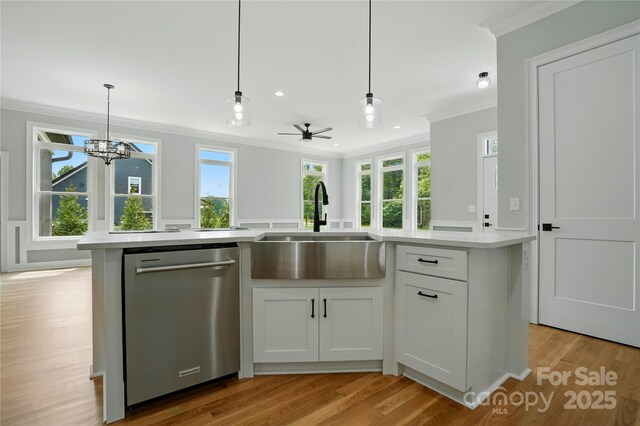 409 Henry Chapel Rd, Belmont, NC 28012 - kitchen with dishwasher, crown molding, light countertops, light wood-style flooring, and healthy amount of natural light