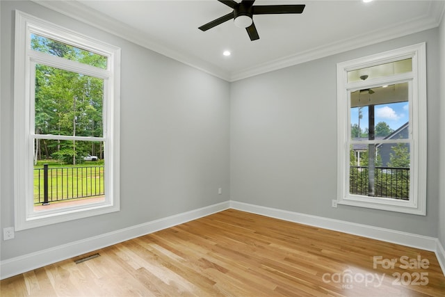 409 Henry Chapel Rd, Belmont, NC 28012 - empty room with healthy amount of natural light, crown molding, light wood-type flooring, a ceiling fan, and recessed lighting