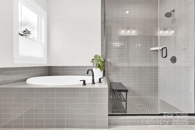 bathroom featuring a garden tub and a stall shower