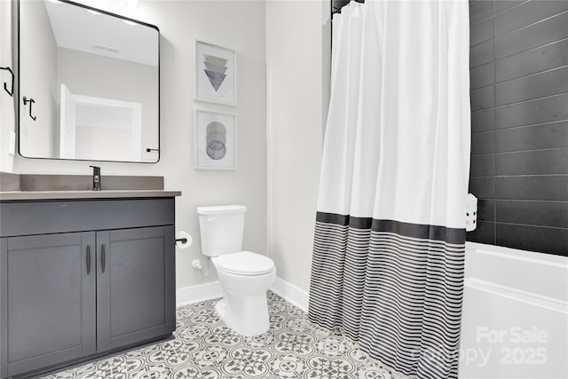 full bathroom with tile patterned flooring, shower / tub combo with curtain, vanity, toilet, and baseboards