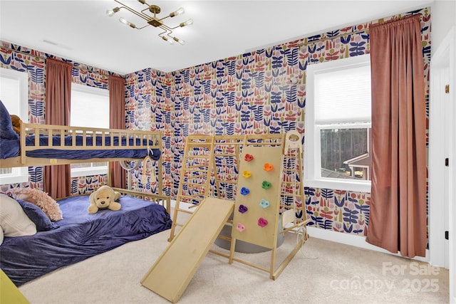 bedroom featuring carpet floors and wallpapered walls