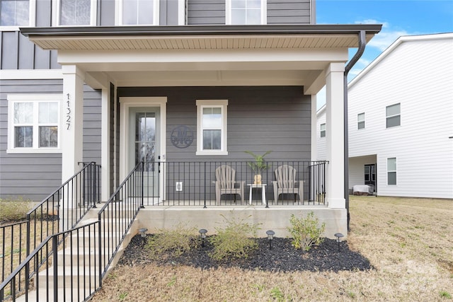 entrance to property featuring a porch