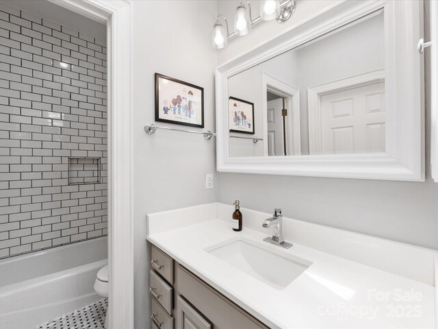 full bathroom with bathtub / shower combination, toilet, and vanity