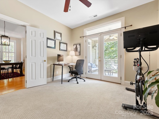 office area with french doors, ceiling fan with notable chandelier, and visible vents