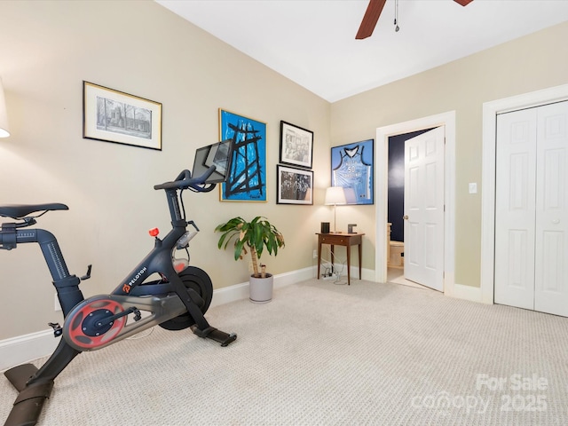 exercise room with carpet flooring, baseboards, and ceiling fan