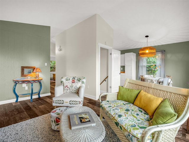 living room with baseboards and wood finished floors