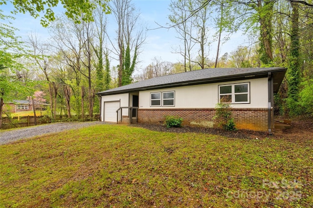 2694 W Lakeshore Dr, Landrum, SC 29356 - ranch-style home with brick siding, a garage, driveway, and a front lawn