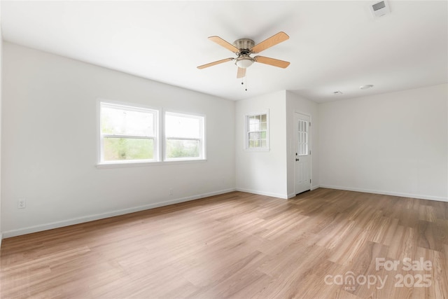 2694 W Lakeshore Dr, Landrum, SC 29356 - empty room with light wood-style floors, ceiling fan, and baseboards