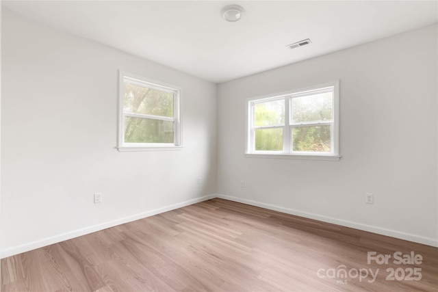 2694 W Lakeshore Dr, Landrum, SC 29356 - spare room featuring wood finished floors and baseboards