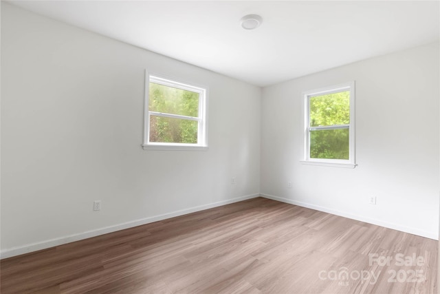 2694 W Lakeshore Dr, Landrum, SC 29356 - empty room with light wood finished floors and baseboards