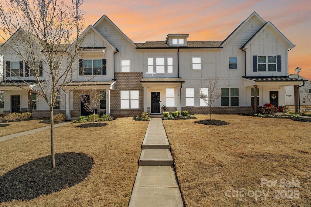 722 Herlong Ave, Rock Hill, SC 29732 - view of property with a front lawn, brick siding, and board and batten siding