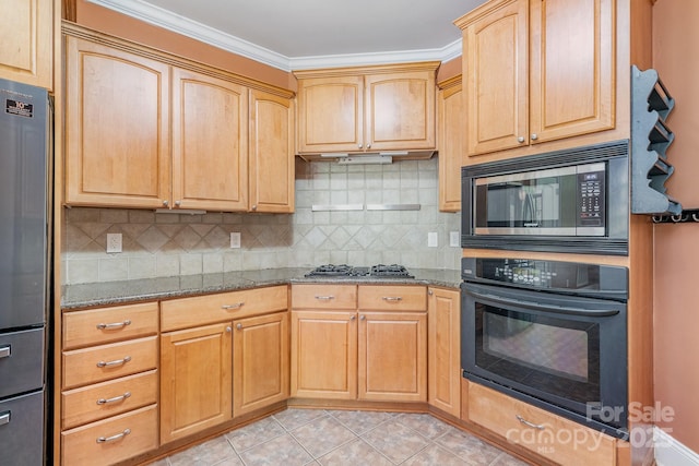 kitchen with backsplash, light tile patterned flooring, light stone countertops, and appliances with stainless steel finishes