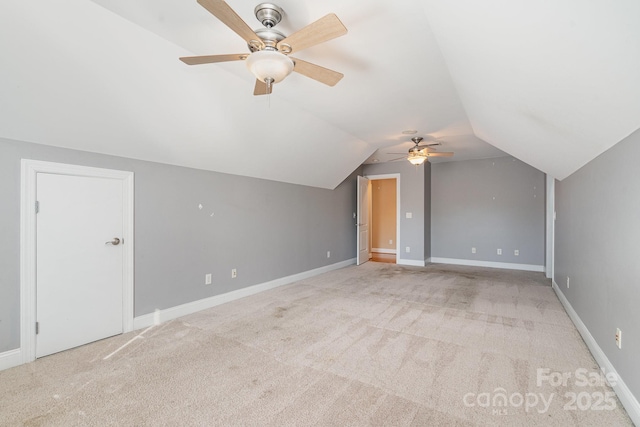 bonus room with ceiling fan, lofted ceiling, baseboards, and carpet