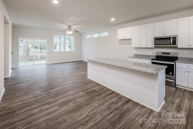 kitchen featuring white cabinetry, ceiling fan, and appliances with stainless steel finishes
