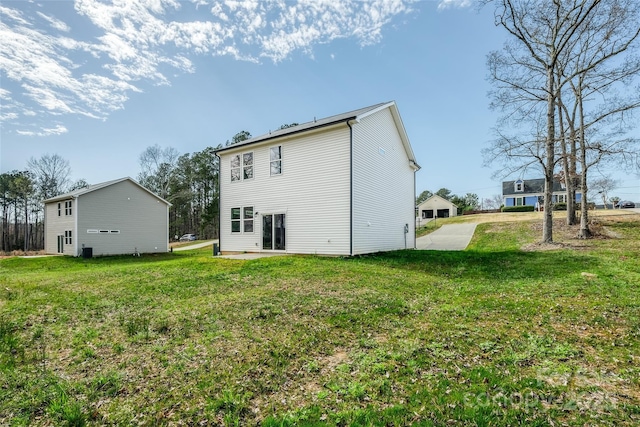 rear view of house with a lawn