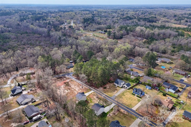 bird's eye view with a forest view