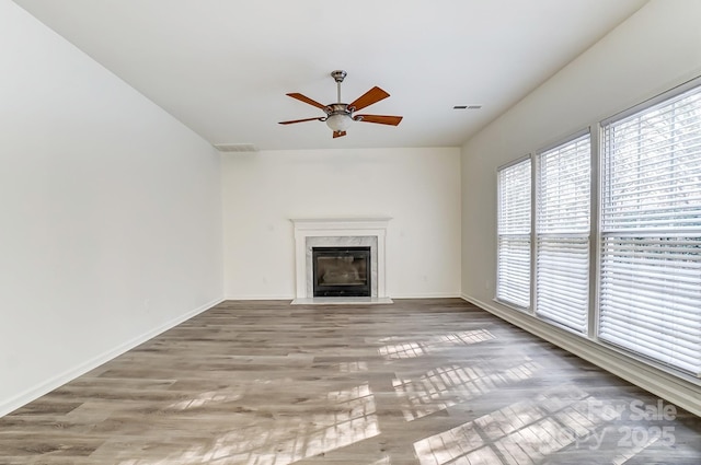 10434 Henbane Ct, Charlotte, NC 28213 - unfurnished living room with wood finished floors, a ceiling fan, visible vents, and baseboards