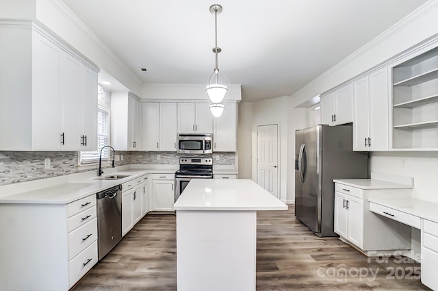 10434 Henbane Ct, Charlotte, NC 28213 - kitchen with a sink, a kitchen island, appliances with stainless steel finishes, wood finished floors, and open shelves