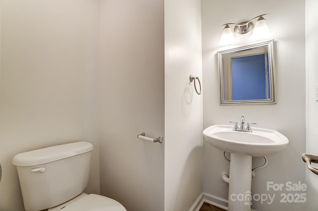 10434 Henbane Ct, Charlotte, NC 28213 - half bathroom with a sink and toilet