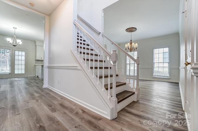 10434 Henbane Ct, Charlotte, NC 28213 - stairs featuring a chandelier, baseboards, and wood finished floors