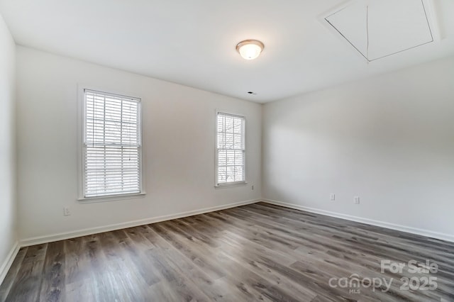 10434 Henbane Ct, Charlotte, NC 28213 - unfurnished room with baseboards, attic access, and wood finished floors