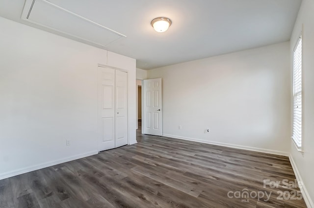 10434 Henbane Ct, Charlotte, NC 28213 - interior space with attic access, dark wood-style floors, a closet, and baseboards