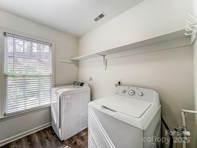 10434 Henbane Ct, Charlotte, NC 28213 - clothes washing area featuring visible vents, baseboards, dark wood finished floors, laundry area, and washer and dryer