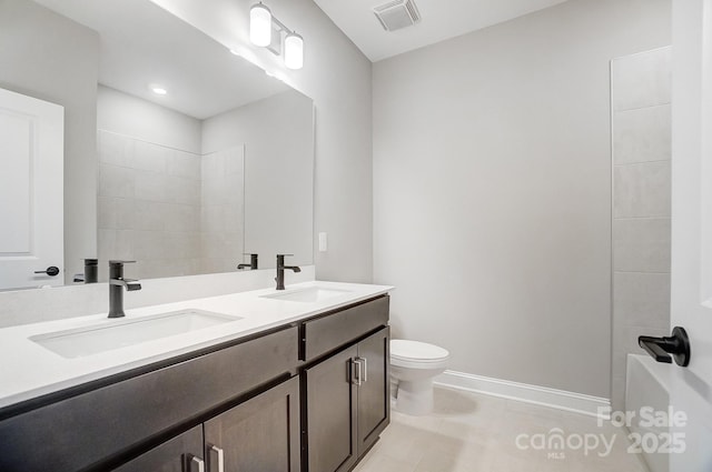 522 Fern Hill Rd Unit 17, Mooresville, NC 28117 - full bathroom with visible vents, baseboards, a sink, and toilet