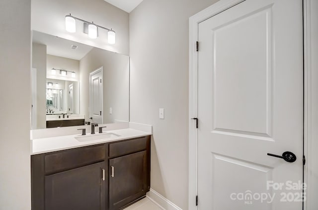 522 Fern Hill Rd Unit 17, Mooresville, NC 28117 - bathroom with visible vents, baseboards, and vanity